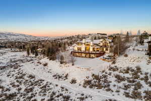 Snowy aerial view featuring a mountain view