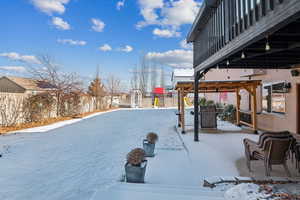 Snowy yard with a playground