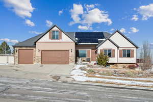 Craftsman house featuring solar panels