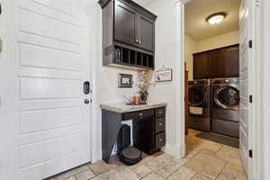 Laundry area with cabinets and washing machine and dryer