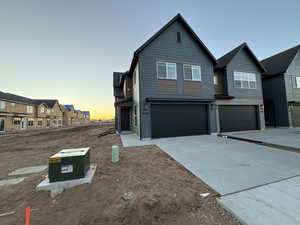 View of front of home featuring a garage