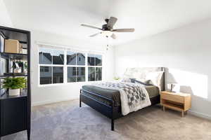 Bedroom featuring ceiling fan and carpet flooring