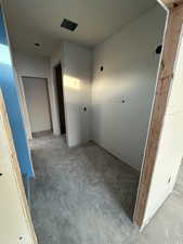 Hallway with concrete flooring