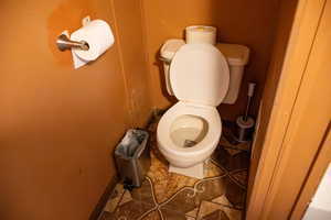 Bathroom with tile patterned floors and toilet