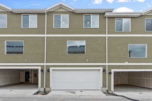 Rear view of house with a garage