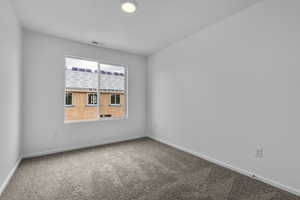 Unfurnished room featuring carpet