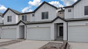 View of front of property featuring a garage