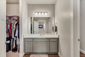 Bathroom featuring hardwood / wood-style floors and vanity