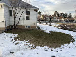 View of yard covered in snow