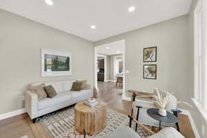 Living room with hardwood / wood-style flooring