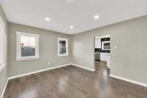 Unfurnished room with sink and hardwood / wood-style floors