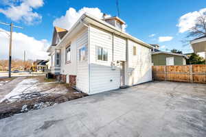 Rear view of property with central air condition unit