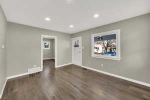 Foyer featuring dark wood-type flooring