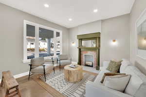 Living room featuring a fireplace and light hardwood / wood-style flooring