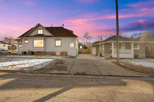 View of front of home featuring covered porch and central air condition unit