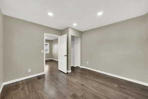 Interior space featuring dark wood-type flooring