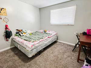 View of carpeted bedroom