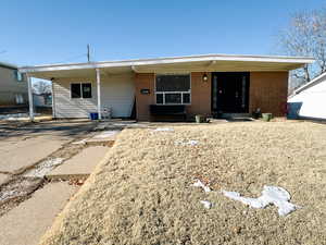 View of front of house featuring a carport