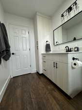 Bathroom featuring wood-type flooring and vanity