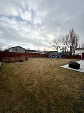 View of yard with a playground and a patio area