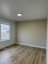 Empty room featuring light wood-type flooring