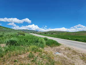 Property view of mountains with a rural view