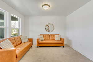 Living room with light colored carpet