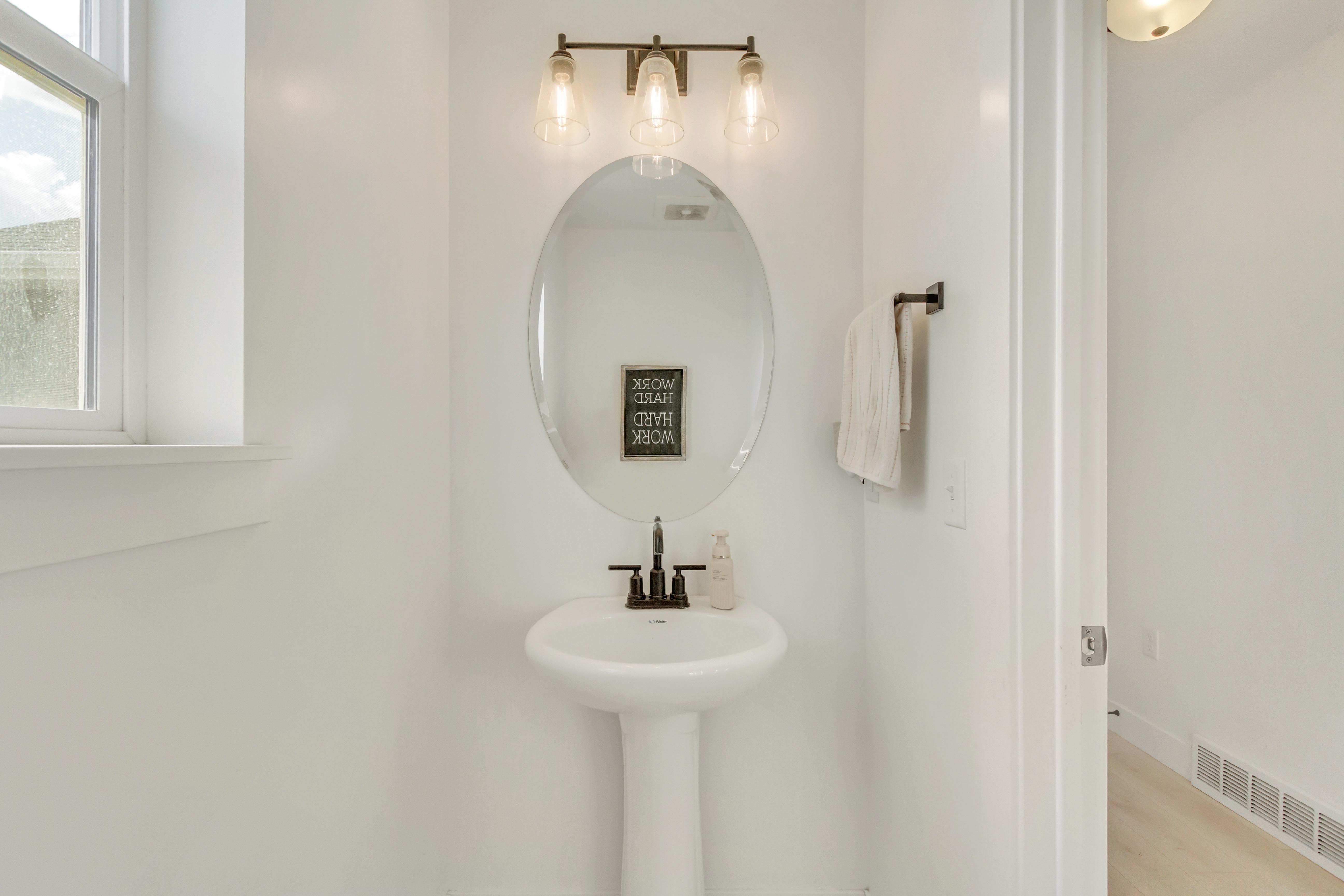 Bathroom with hardwood / wood-style flooring