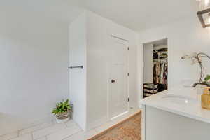 Bathroom featuring vanity and tile patterned flooring