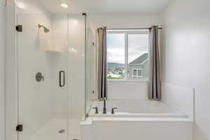 Bathroom with plus walk in shower and a mountain view