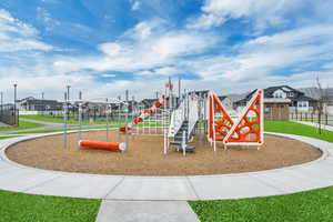 View of play area featuring a yard