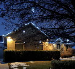 Property exterior at night with a garage