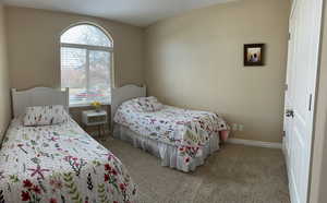 Bedroom #3 with light colored carpet and double closet with organizers