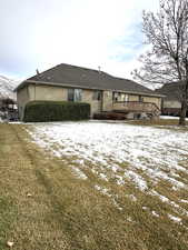 View of backyard facing East featuring a deck and a lawn