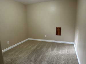 Bedroom #5 with light colored carpet and water shut-off