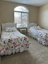 Bedroom #3 featuring light colored carpet flooring