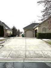 View of South side of property with a 3-car garage