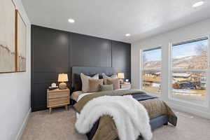 Carpeted bedroom with a textured ceiling