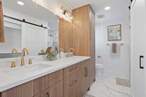 Bathroom featuring toilet and vanity