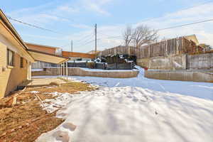 View of yard covered in snow