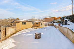 View of yard layered in snow