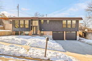 Split foyer home featuring a garage