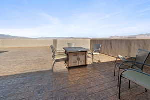 View of rooftop with a mountain view