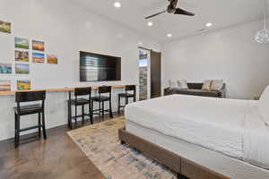 Bedroom with ceiling fan and a barn door