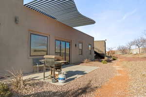 Rear view of house featuring a patio