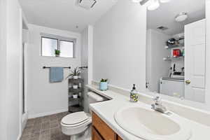 Bathroom with new LVP flooring and Washer/Dryer