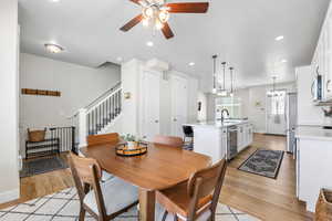 Dining space featuring ceiling fan.