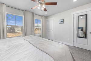 Carpeted primary bedroom with great window views.