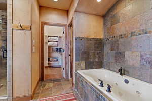 Bathroom with shower with separate bathtub