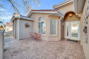 Doorway to property with a patio